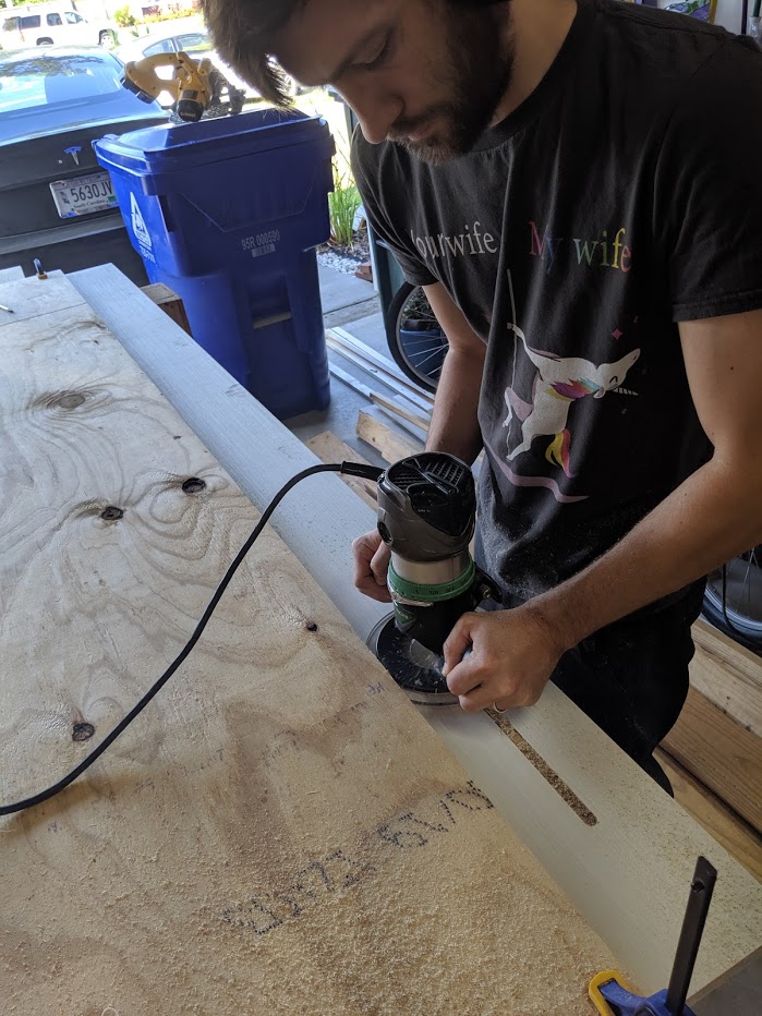  A 5/8 inch wide router bit was used to make a channel for the LEDs at the back edge of the sheets of plywood used for the desktop. The channel was just deep enough to accommodate the thickness of the strips (3/16 inch). It was located about 3 inches from the back edge. The factory edge of another sheet of plywood was used as guide for the router base. The width of the desk was 30 inches. It extended 8 feet along one wall and 12 feet along the other. 